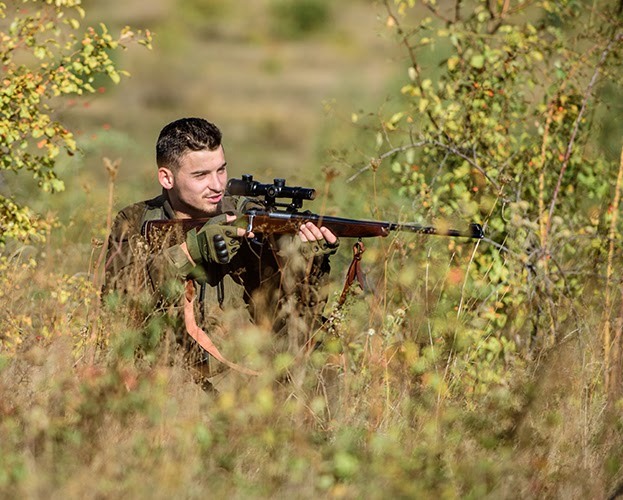 Male hunter in bush